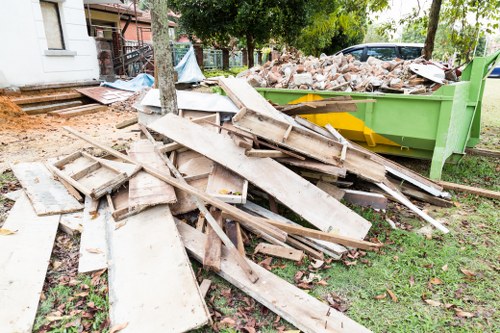 Professionals conducting loft clearance in a Southgate home