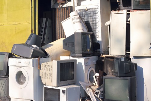 Mechanic inspecting shredder equipment during maintenance